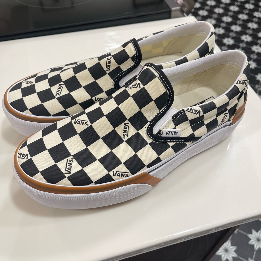 Platform “Stackform” slip on checkered Vans